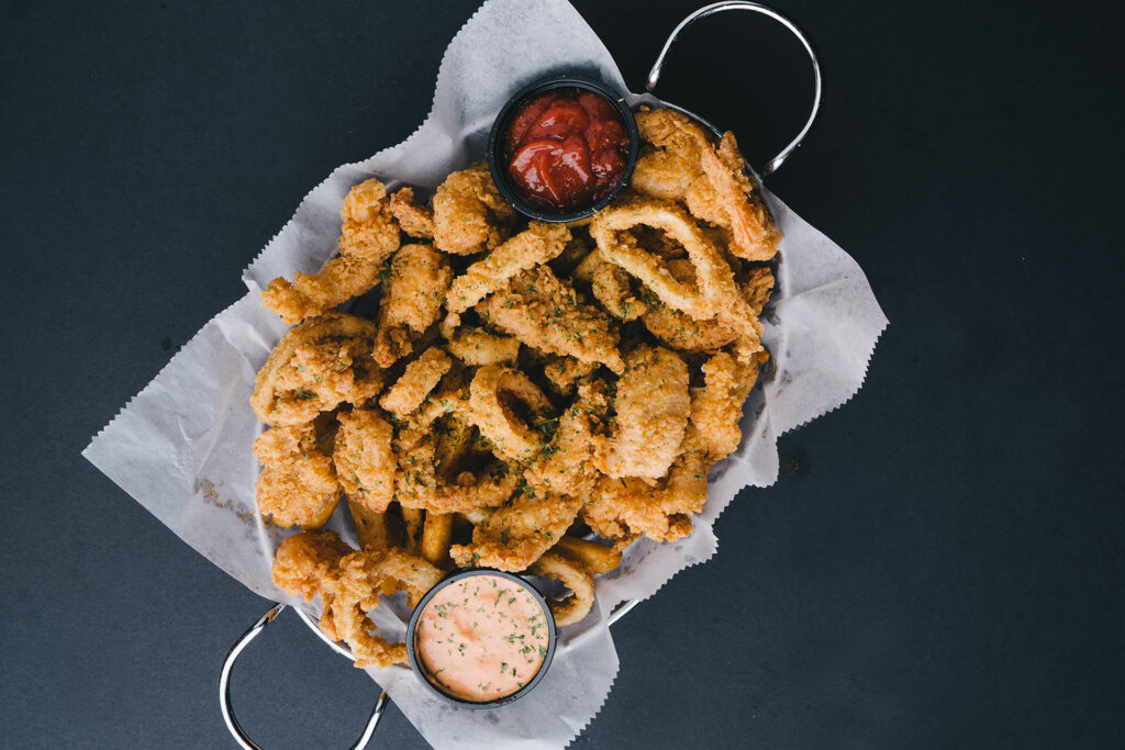 Fried shrimp, calamari, and catfish with our delicious dipping sauces at Chasin Tails in Virginia