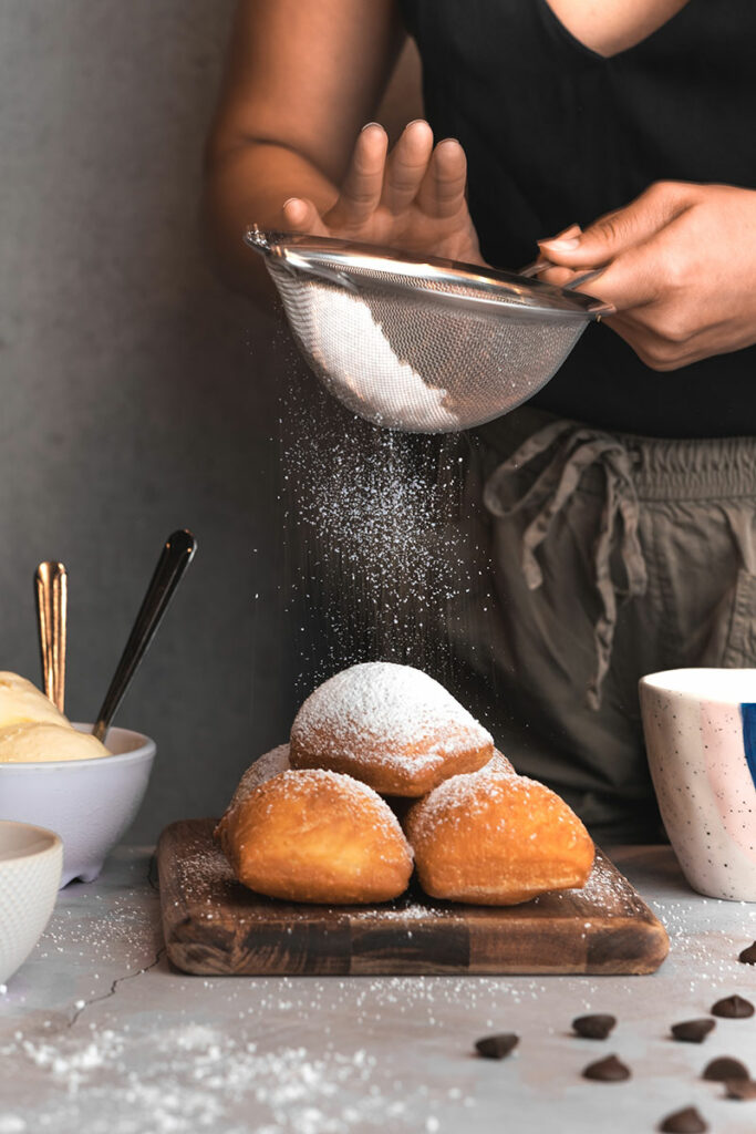 Powdered sugar dusting beignets at Chasin Tails in Virginia